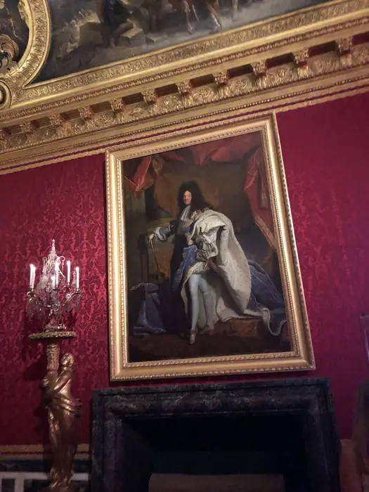 Hyacinthe Rigaud's celebrated portrait of Louis XIV, on crimson damask.
